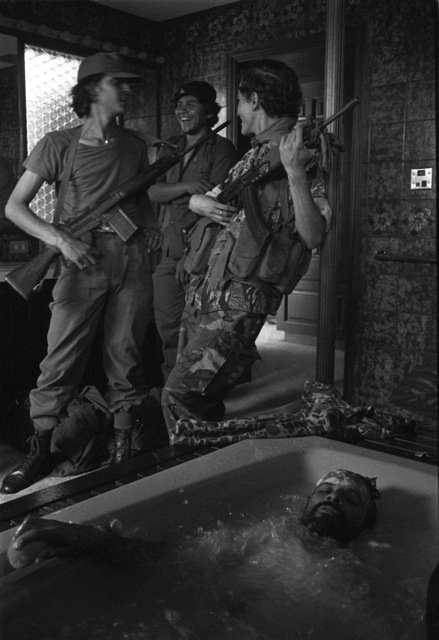 Soldiers laughing, a man in a bathtub