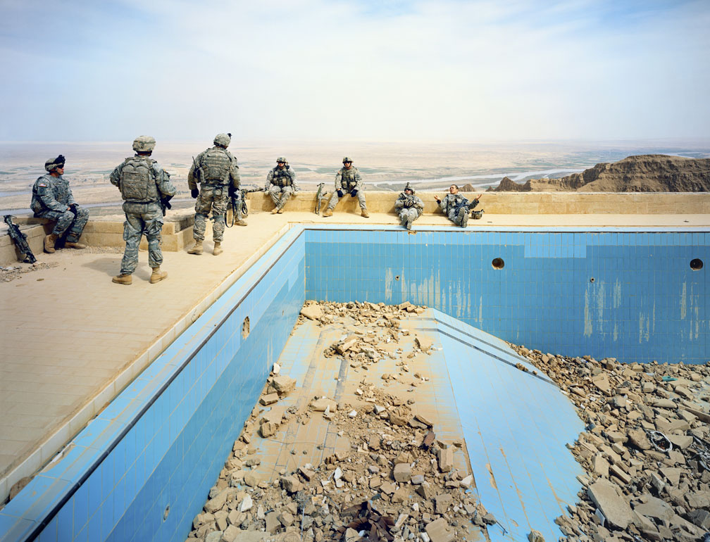 Soldiers by an empty pool 