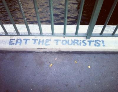 Graffiti reading "Eat the Tourists"