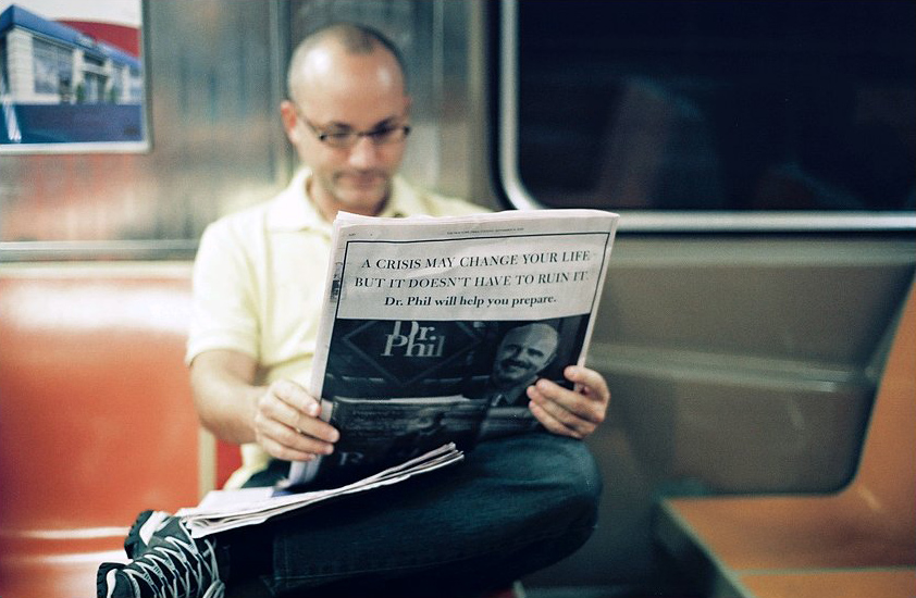 man reading subway
