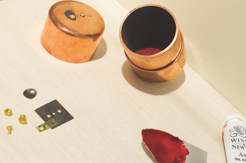 Keats’s Millennium Camera execution. Visible are the camera’s copper casing and 24-carat-gold aperture, as well as the rose madder pigment used for the interior of the device. Rob Mattson/Amherst College.