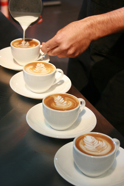 Barista pouring coffee