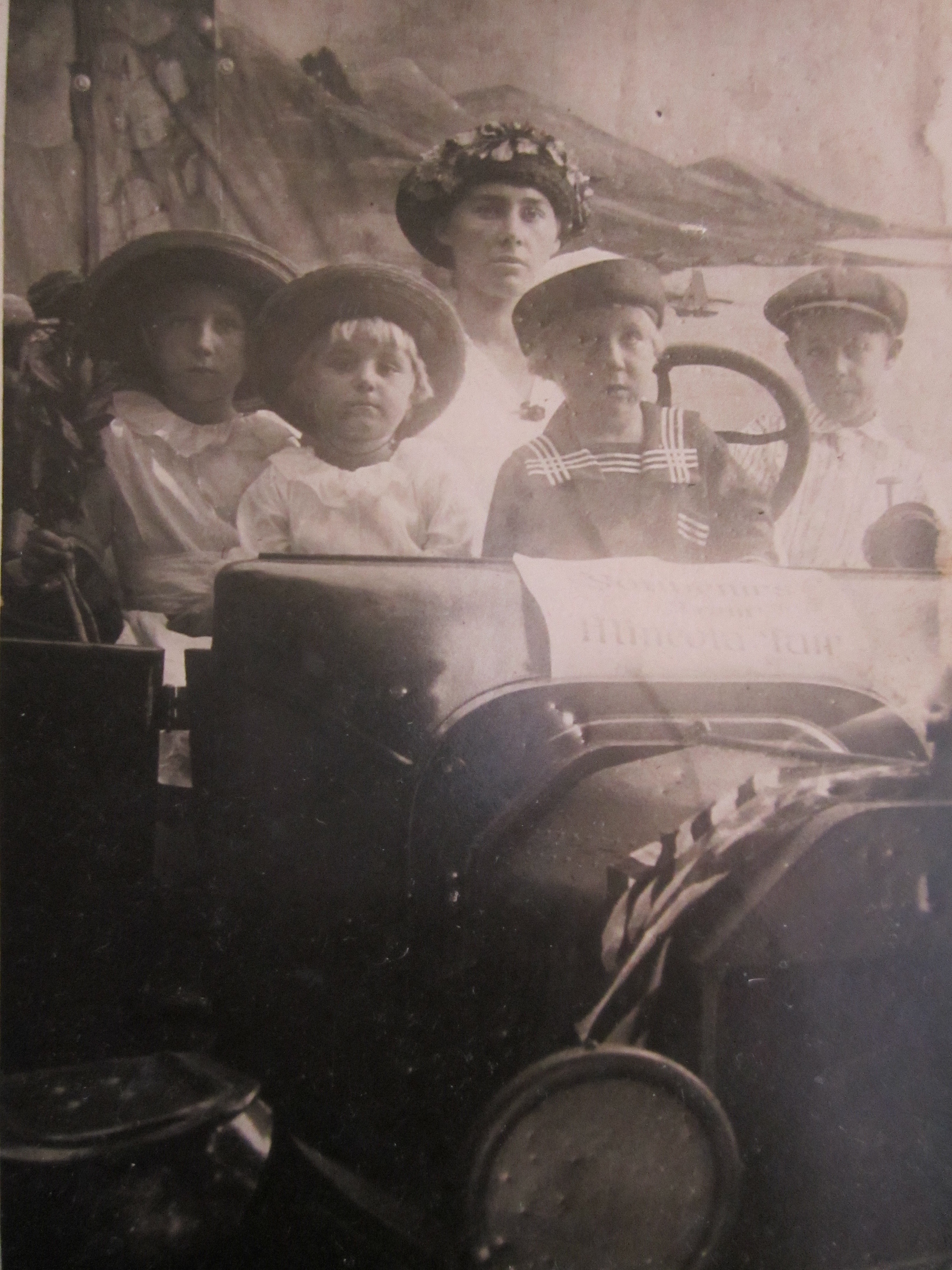 Stella’s Children Look Out From a Photo Faded Gold