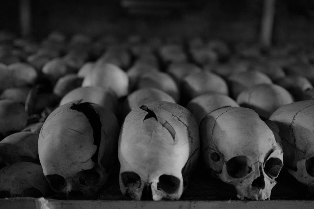 Skulls line shelves inside the Ntarama Church where Rwandans were instead killed enmasse, many with machetes. Some of the skulls bear signs of the violence that took place here.