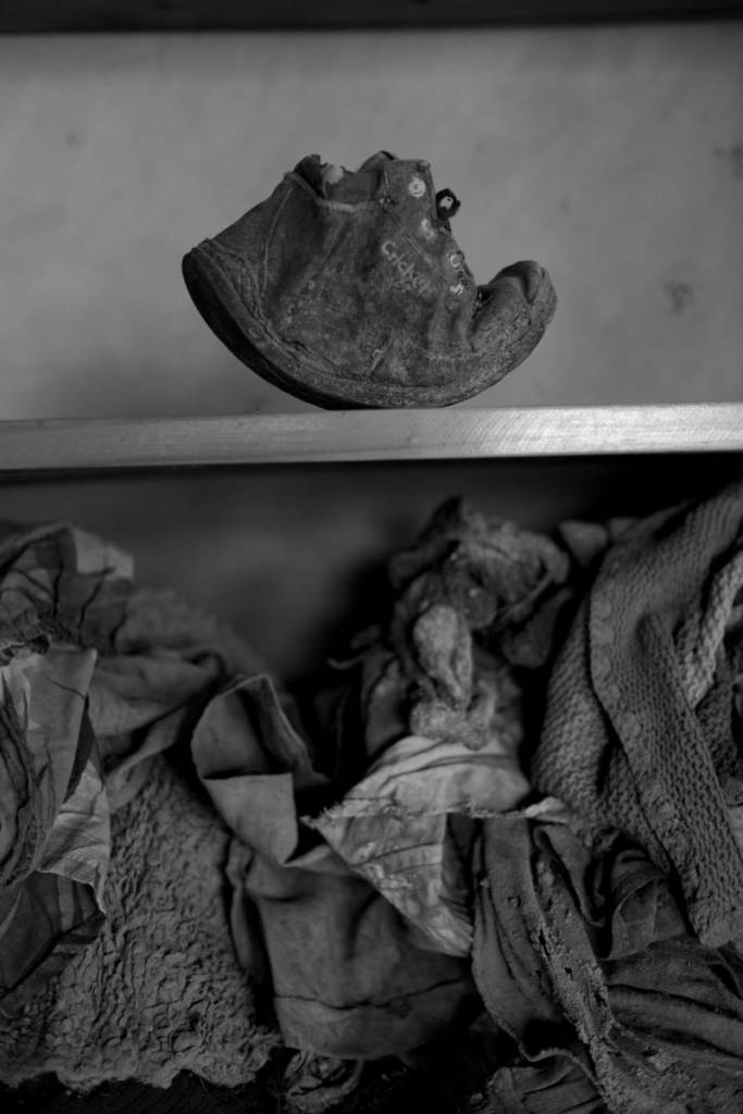 The scraps of clothing are also from the red-brick, Christian Ntarama Church, where it is said the children were killed by smashing their skulls against one wall. Both relatives and visitors still come daily to pay their respects and honor the lives lost when truckloads of fighters pulled up and broke down the gates surrounding the church.