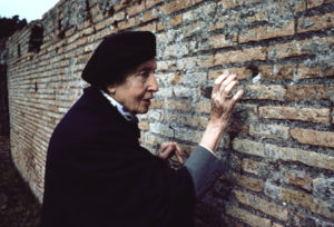 Image of woman touching wall