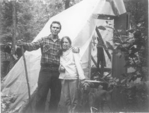 Image of people standing in front of a tent