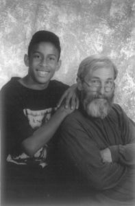 Image of a boy and his father seated