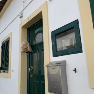 Image of a bag of bread attached to a doorway