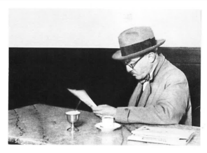 Image of a man sitting in a cafe