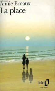 Cover of Annie Ernaux’s La place: two people standing on the beach in the sunset.