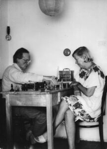 Black and white image of Marcel Duchamp and his wife Alexina playing chess.