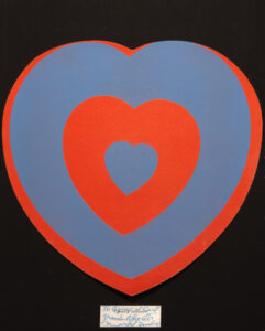 Image of circumscribed red and blue hearts on black background. 