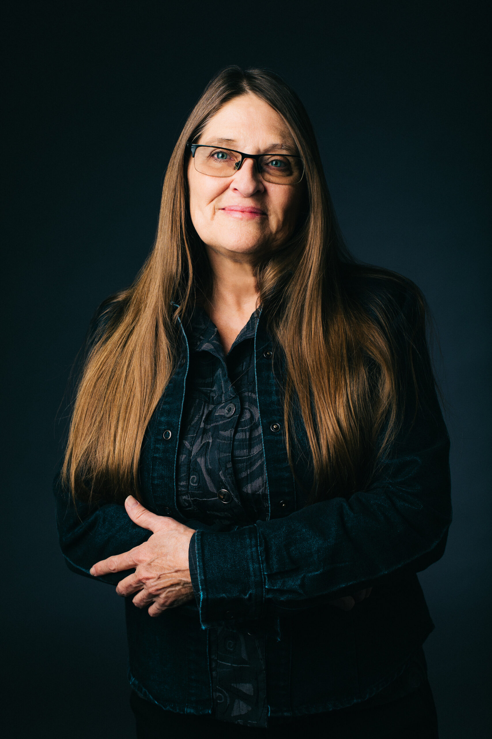 Allison Adelle Hedge Coke's headshot: a woman with long brown hair and glasses smiling at the camera.