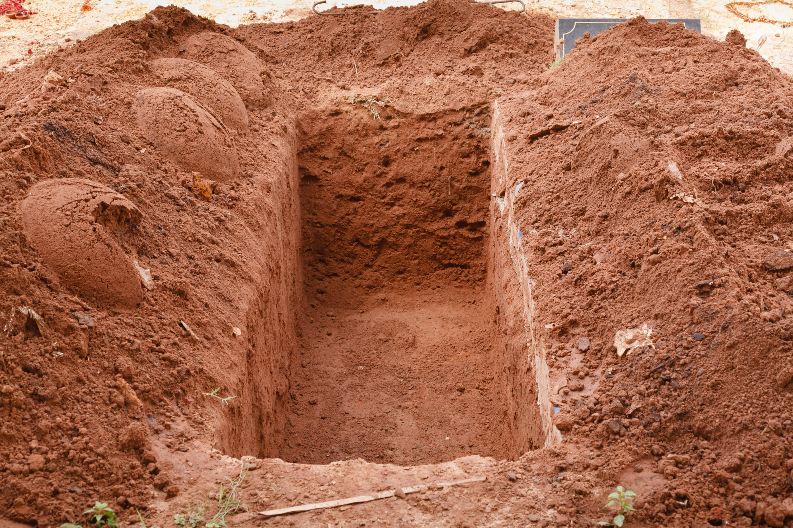 A dirt open grave with no casket