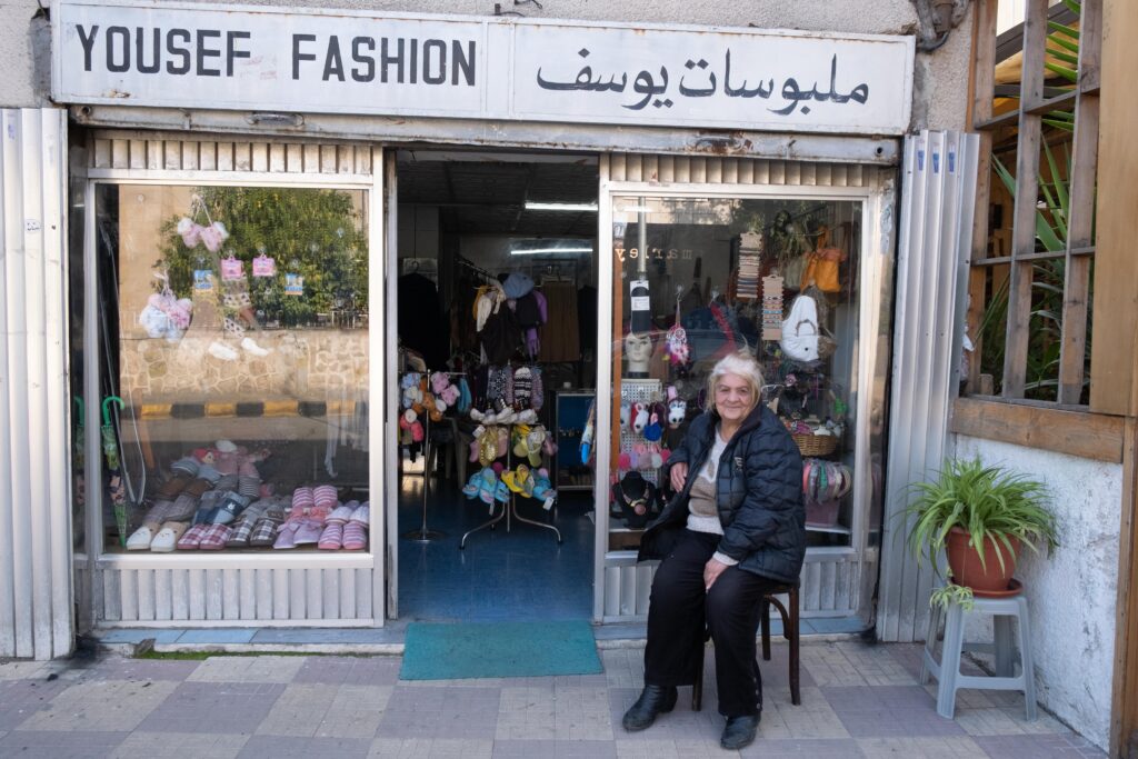 Kulliyat al Shareeah Street is the commercial center of Jabal Al-Lweibdeh. Today it combines old professions with newer, modern shops. Oum Yousef has witnessed all the changes and development in the neighborhood from her shop.