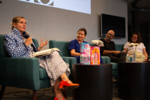 Moderator Leigh Newman and authors Lynn Steger Strong, Rumaan Alam, and Xochitl Gonzalez sit at a couch to have a panel conversation.