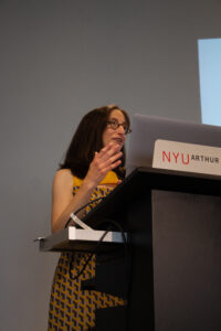 Editor-in-Chief Jennifer Acker stands at a podium.