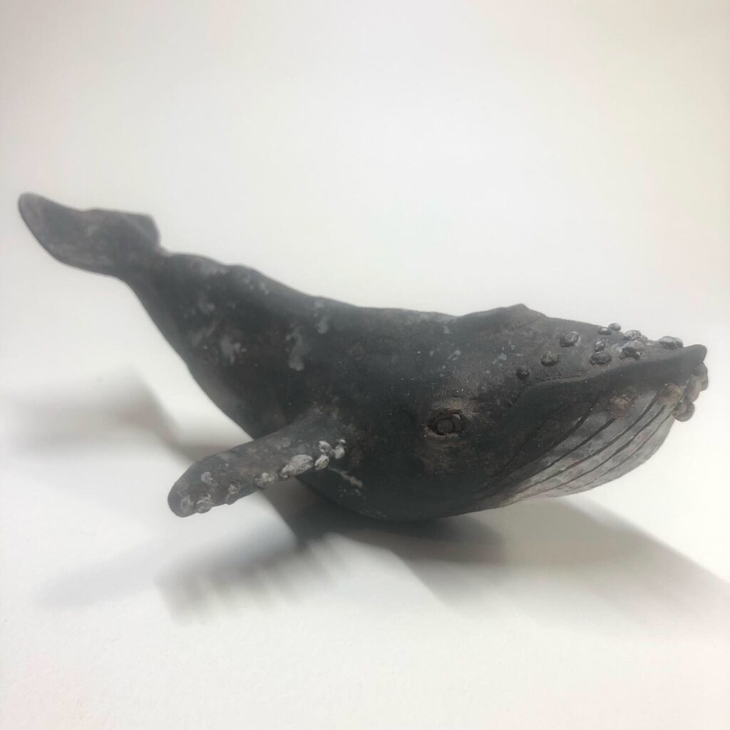 whale sculpture on white background