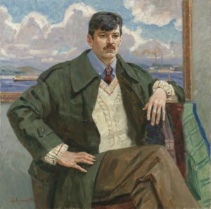Man in a coat sitting down in front of a landscape painting.