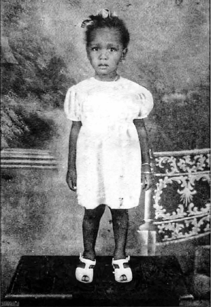 Early photograph of the author in a light-colored dress.